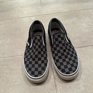 Black and grey checkered slip ons